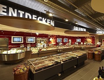 Rewe mit neuem Digital Signage Konzept